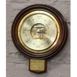 A wall hanging brass mounted barometer titled The Eddie Large Classic Longest Putt 1995.