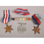 A trio of World War Two medals to include war medal 1939-1945, The 1939-1945 star and The France and