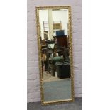 A gilt framed full length bevel edge wall mirror.