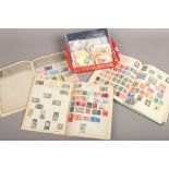 Three stamp album and contents of loose stamps and commemorative stamps.