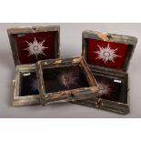 Five small framed stained glass windows with centre star decoration, 19cm x 19cm.