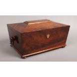 A Regency mahogany twin handle work box of sarcophagus form.