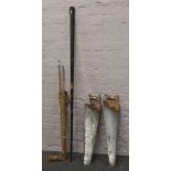 A vintage three piece split cane fly fishing rod in bag, along with a snooker cue in metal holder