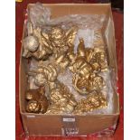 A box of wall hanging display cherubs.