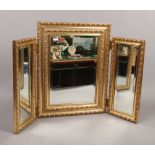 A gilt frame bevel edge triple dressing table mirror.