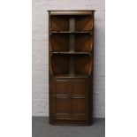 An Ercol corner cupboard.