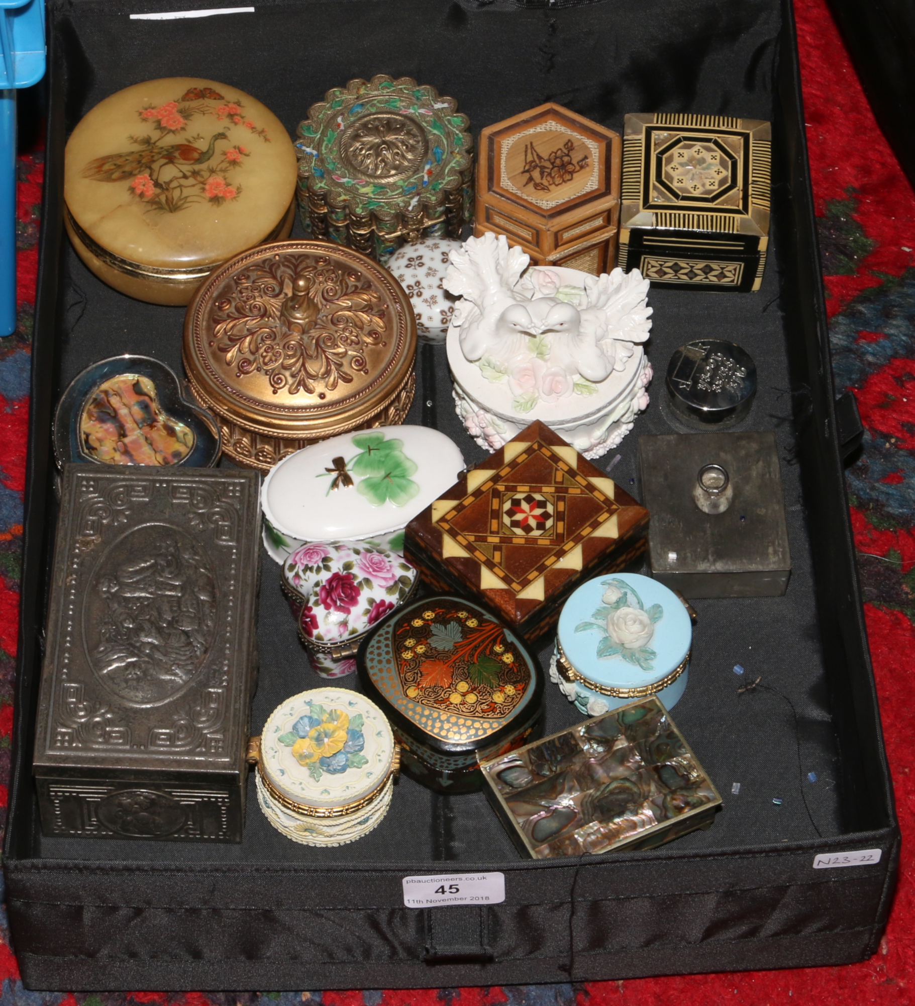 A box of trinket boxes to include ceramic, wooden, metal examples.