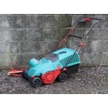 A Bosch ALR 900 electrical lawn raker.