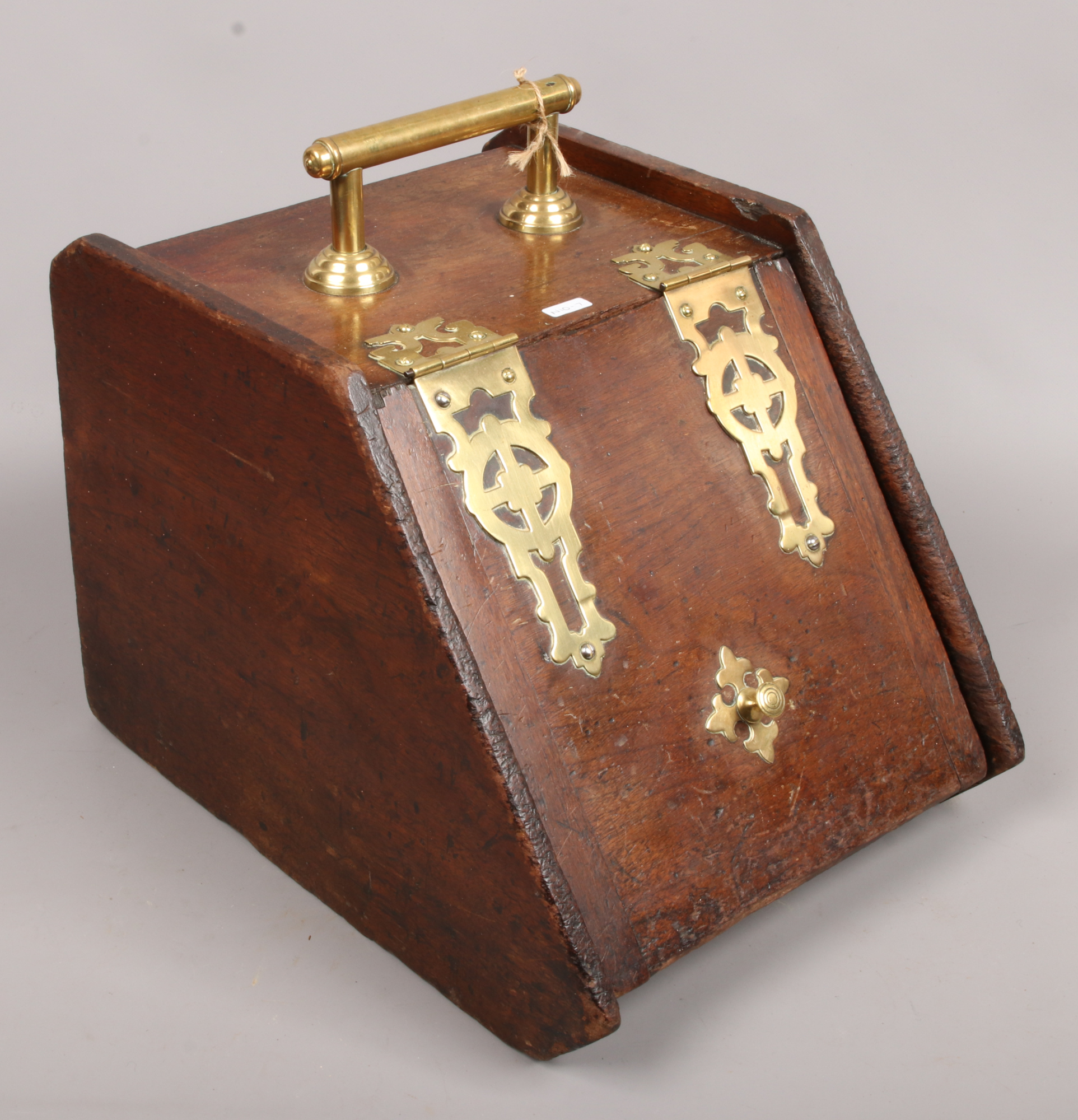 A brass bound coal scuttle with liner.