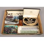A large box of costume jewellery and collectables including amber, simulated pearls, cut throat