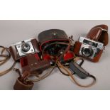 Two vintage SLR 35mm cameras to include AGFA along with a cased pair of Russian binoculars.