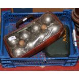 Two cased sets of boules, one by Obut.