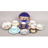 A collection of porcelain cups and saucers, trios etc to include Royal Worcester and hand painted