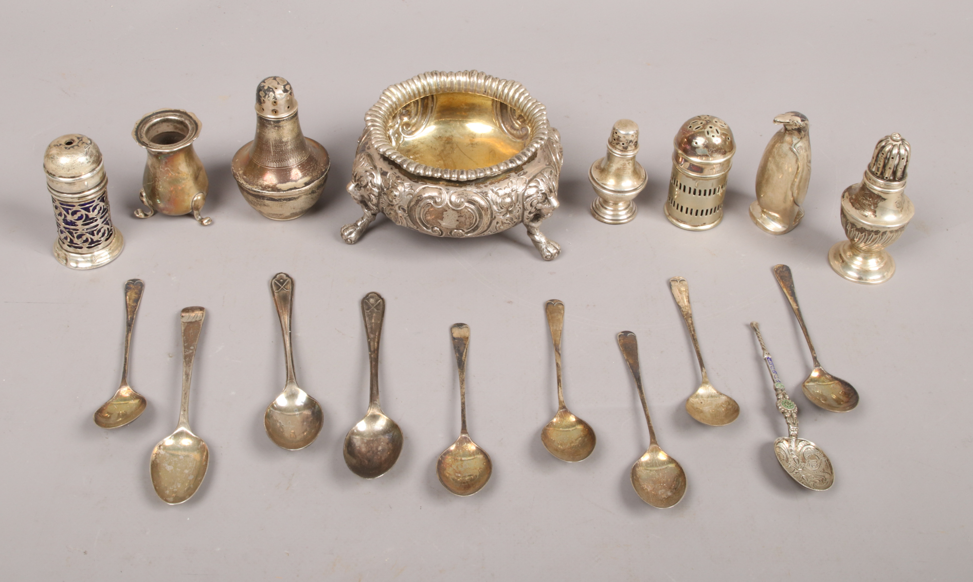 A collection of hall marked silver to include cruets, spoons and large salt, 410 grams total