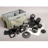 A Minolta 7000 35mm SLR camera in carry case with Minolta and Sigma lenses, manual etc.