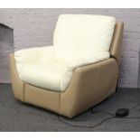 A cream and mocha two tone leather reclining armchair.