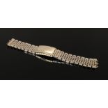 A gold plated and stainless steel Omega watch bracelet.
