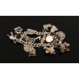 A silver charm bracelet to include love heart lock charm, horseshoe charm, coin charm etc, weight 70