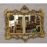 A rococo style gilt metal frame mirror, 74cm x 85cm.