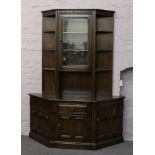 A craved and panelled Ercol wall unit.