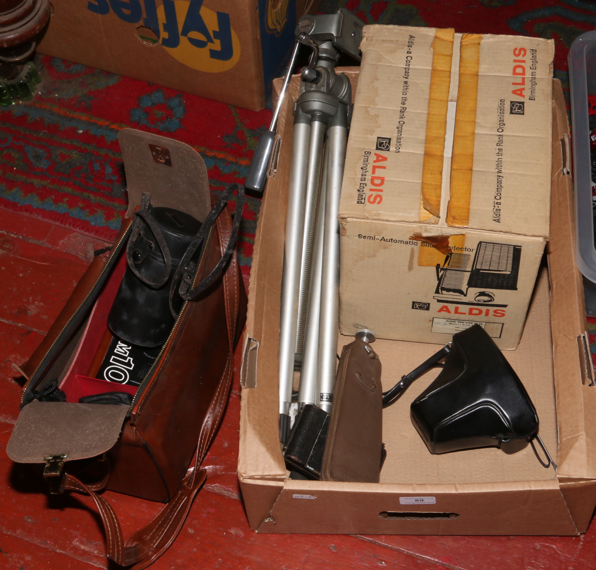 A box of photographic to include Olympus OM-10 camera, Lukos II pocket camera,  Velbon tripod etc.