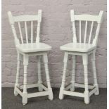 A pair of painted spindle back kitchen stools.