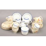 A six place floral transfer printed tea service stamped England 85 along with a blue and white