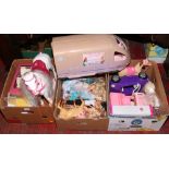 Three boxes of Barbie dolls, toys and horses to include large train, people carrier etc.