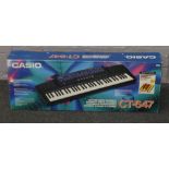 A boxed Casio CT-647 keyboard.
