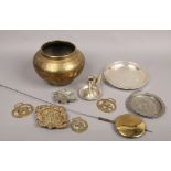 A collection of metalwares including Indian brass bowl, horse brasses, chamber stick with snuffer