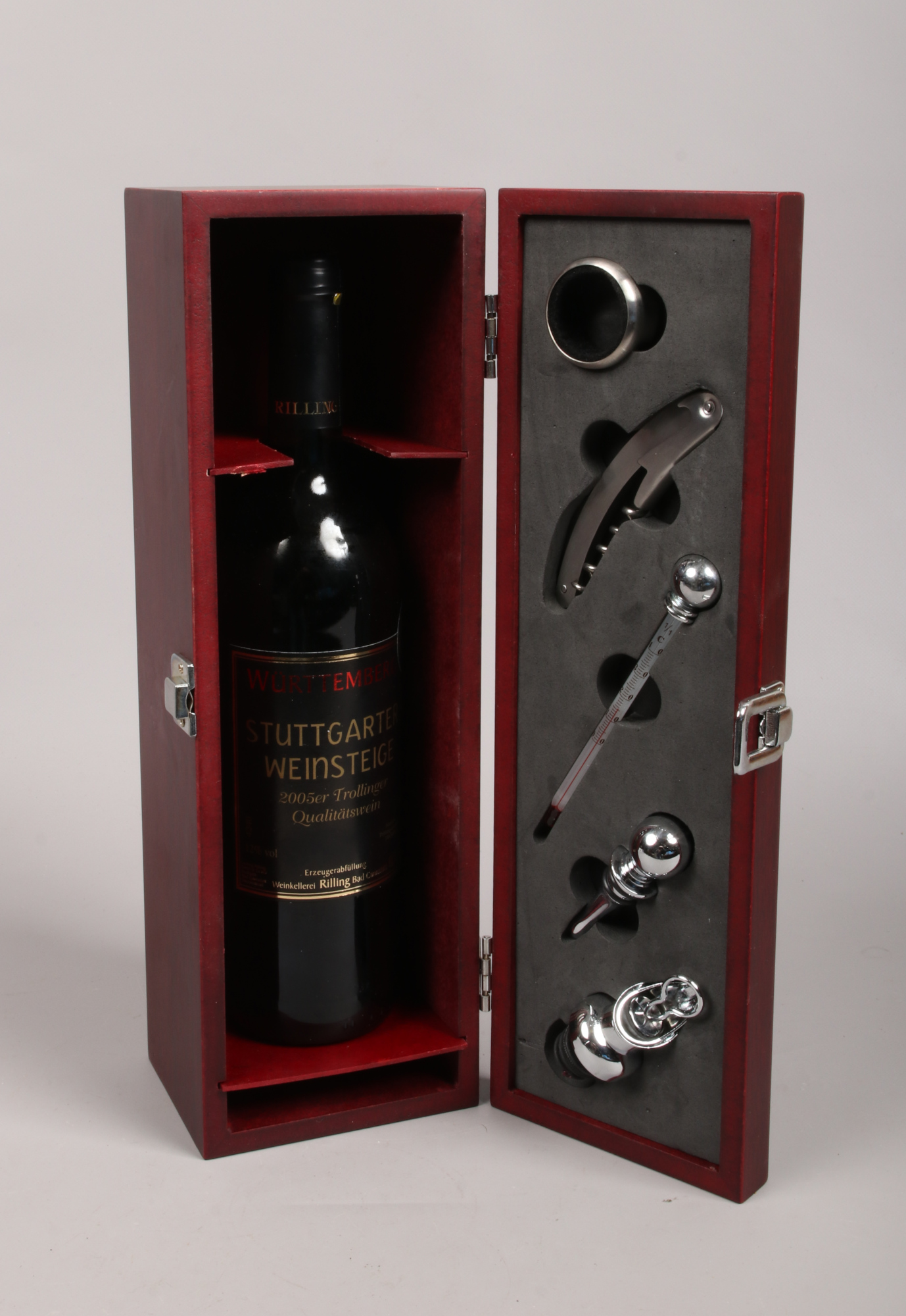 A mahogany glazed wine set with Wurttemberg 2005 Trollinger produced in Germany.