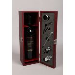 A mahogany glazed wine set with Wurttemberg 2005 Trollinger produced in Germany.