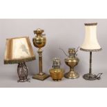 Three brass based oil lamps to include Corinthian column, along with a wrought iron and wire work