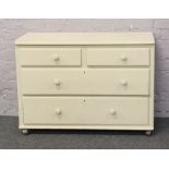 A painted two over two chest of drawers.