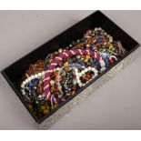 A box of various bead necklaces.