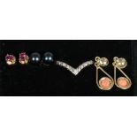 A 14ct gold wishbone ring and three pairs of 14ct gold earrings set with coral, ruby and pearl the