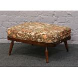 An Ercol style floral upholstered top stool.