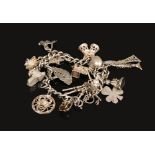 A silver charm bracelet to include a quantity of silver charms, weight 50 grams.