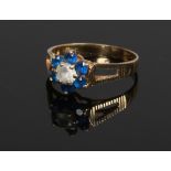 A 9ct gold diamond and sapphire ring of floriform, size K.