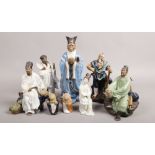 A collection of clay Chinese figures, mainly of sages.