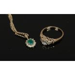A 9ct gold three stone diamond ring, size I and a gem set pendant on 9ct gold chain.