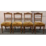 A set of four Victorian carved mahogany salon chairs.