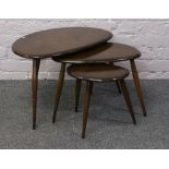 A nest of three Ercol pebble tables.