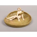 A Royal Dux lilly pad with semi naked girl.