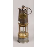 A Wolf Patterson miners safety lamp by W. M. Maurice Limited Sheffield.