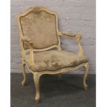 A French style lined and upholstered hardwood arm chair.