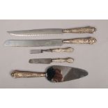 Five silver handled items of cutlery with various assay marks to include London / Sheffield in the