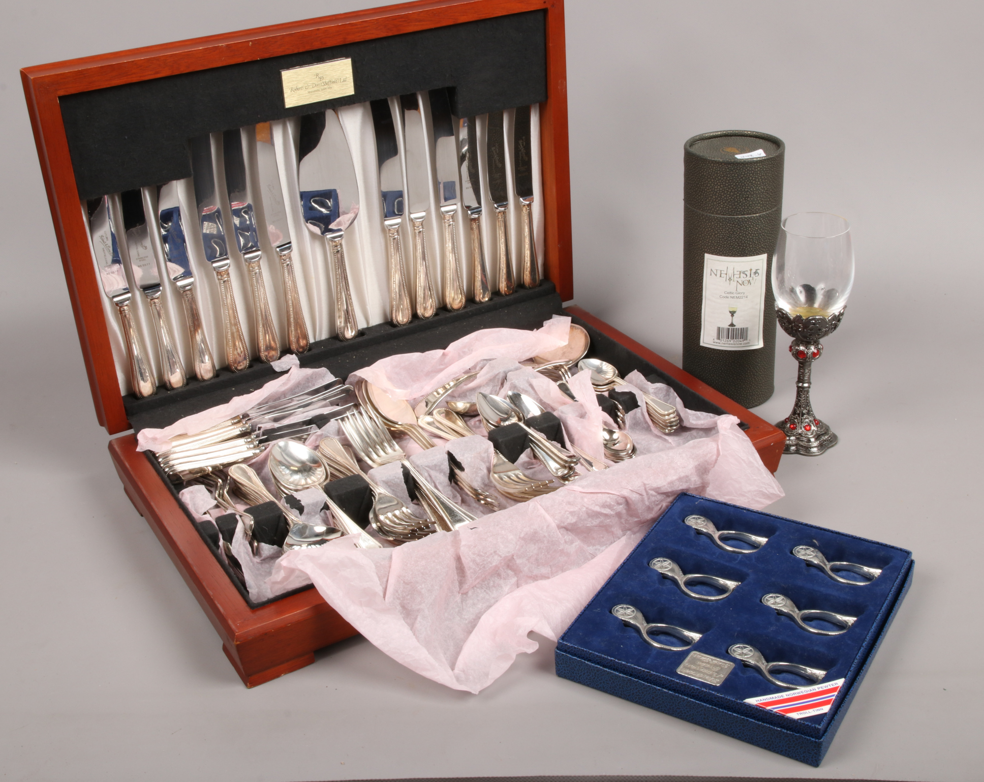 A Roberts & Dore silver plate canteen of cutlery, along with a cased set of six Troll - Tinn