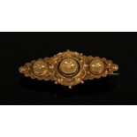 A Victorian 15ct gold lozenge shaped brooch set with fusee diamond chips, 4.1 grams.