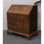 A Georgian oak bureau with fitted interior.